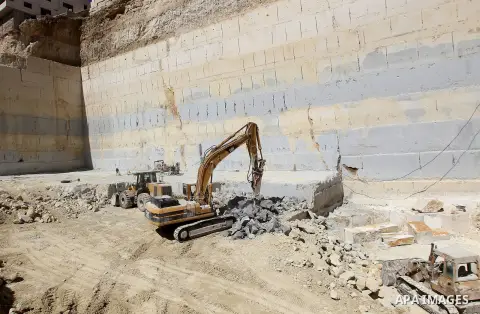 Palestinian labourers work at a quarry in the West Bank village of Taffouh near Hebron, 08 March 2017. According to the Palestinian Union of Stone and Marble, the stone and marble sector is considered to be one of the mo...