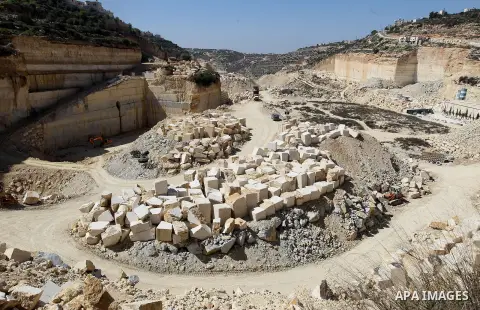 Palestinian labourers work at a quarry in the West Bank village of Taffouh near Hebron, 08 March 2017. According to the Palestinian Union of Stone and Marble, the stone and marble sector is considered to be one of the mo...