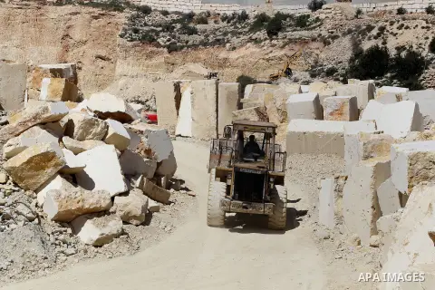 Palestinian labourers work at a quarry in the West Bank village of Taffouh near Hebron, 08 March 2017. According to the Palestinian Union of Stone and Marble, the stone and marble sector is considered to be one of the mo...