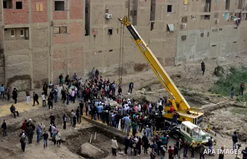 Egyptian workers excavate the statue, recently discovered by a team of German-Egyptian archeologists, in Cairo's Mattarya district on March 13, 2017. Statues of the kings and queens of the nineteenth dynasty (1295 - 1185...