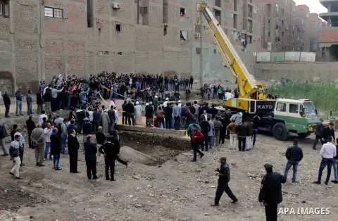 Egyptian workers excavate the statue, recently discovered by a team of German-Egyptian archeologists, in Cairo's Mattarya district on March 13, 2017. Statues of the kings and queens of the nineteenth dynasty (1295 - 1185...