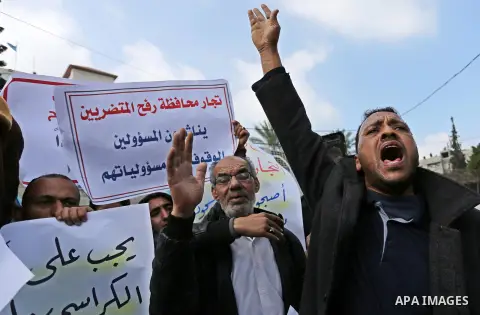 Palestinian factories owners demonstrate on March 13, 2017 outside the UN offices in Gaza City as their business were not yet rebuild since the 2014 war between Hamas militants and Israel. Photo by Ashraf Amra