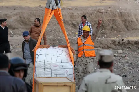 Egyptian workers use crane to lift the statue, recently discovered by a team of German-Egyptian archeologists before transport it to Egyptian museum in Cairo, Egypt on March 15, 2017. Statues of the kings and queens of t...