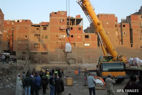 Egyptian workers use crane to lift the statue, recently discovered by a team of German-Egyptian archeologists before transport it to Egyptian museum in Cairo, Egypt on March 15, 2017. Statues of the kings and queens of t...
