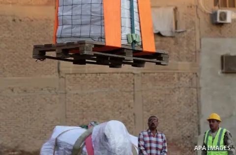 Egyptian workers use crane to lift the statue, recently discovered by a team of German-Egyptian archeologists before transport it to Egyptian museum in Cairo, Egypt on March 15, 2017. Statues of the kings and queens of t...