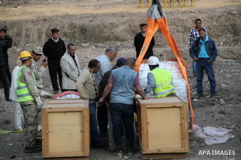 Egyptian workers use crane to lift the statue, recently discovered by a team of German-Egyptian archeologists before transport it to Egyptian museum in Cairo, Egypt on March 15, 2017. Statues of the kings and queens of t...
