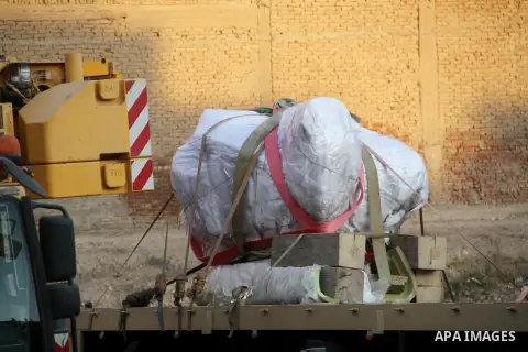 Egyptian workers use crane to lift the statue, recently discovered by a team of German-Egyptian archeologists before transport it to Egyptian museum in Cairo, Egypt on March 15, 2017. Statues of the kings and queens of t...