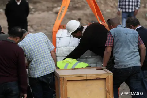 Egyptian workers use crane to lift the statue, recently discovered by a team of German-Egyptian archeologists before transport it to Egyptian museum in Cairo, Egypt on March 15, 2017. Statues of the kings and queens of t...