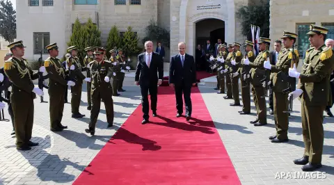 Palestinian Prime Minister Rami Hamdallah and Andrej Kiska, President of the Slovak Republic, inspect the honor guard in the West Bank city of Ramallah, on March 28, 2017. Photo by Prime Minister Office