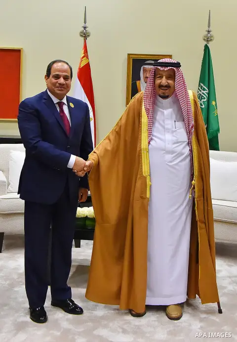 Egypt's President Abdel Fattah al-Sisi shakes hands with Saudi Arabia's King Salman bin Abdulaziz al-Saud, on the sideline of the 28th Summit of the Arab League at the Dead Sea, Jordan March 29, 2017. Photo by Egyptian P...