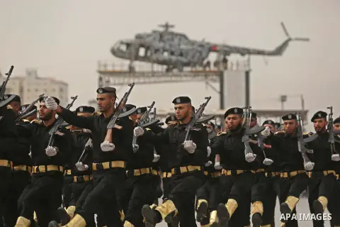 Palestinian police officers loyal to Hamas take part in a graduation ceremony in Gaza City March 30, 2017. Photo by Ashraf Amra