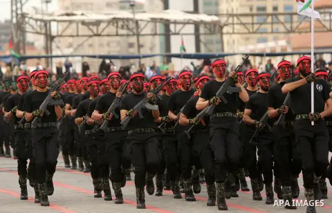 Palestinian police officers loyal to Hamas take part in a graduation ceremony in Gaza City March 30, 2017. Photo by Ashraf Amra
