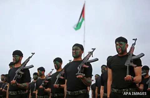 Palestinian police officers loyal to Hamas take part in a graduation ceremony in Gaza City March 30, 2017. Photo by Ashraf Amra