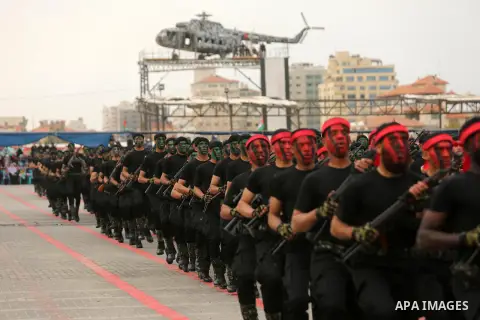 Palestinian police officers loyal to Hamas take part in a graduation ceremony in Gaza City March 30, 2017. Photo by Ashraf Amra