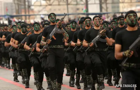Palestinian police officers loyal to Hamas take part in a graduation ceremony in Gaza City March 30, 2017. Photo by Ashraf Amra