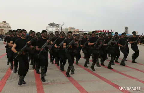 Palestinian police officers loyal to Hamas take part in a graduation ceremony in Gaza City March 30, 2017. Photo by Ashraf Amra