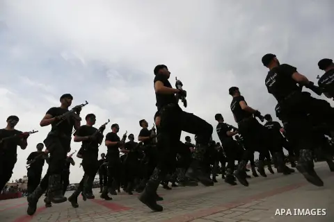 Palestinian police officers loyal to Hamas take part in a graduation ceremony in Gaza City March 30, 2017. Photo by Ashraf Amra
