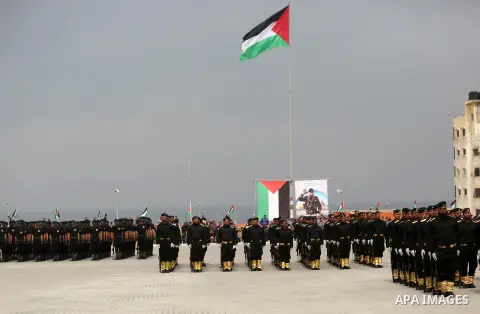 Palestinian police officers loyal to Hamas take part in a graduation ceremony in Gaza City March 30, 2017. Photo by Ashraf Amra