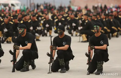 Palestinian police officers loyal to Hamas take part in a graduation ceremony in Gaza City March 30, 2017. Photo by Ashraf Amra