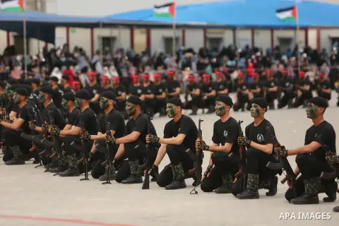 Palestinian police officers loyal to Hamas take part in a graduation ceremony in Gaza City March 30, 2017. Photo by Ashraf Amra