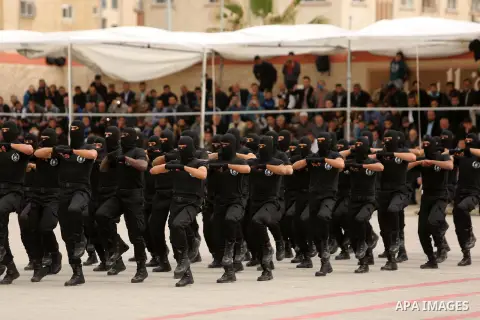 Palestinian police officers loyal to Hamas take part in a graduation ceremony in Gaza City March 30, 2017. Photo by Ashraf Amra