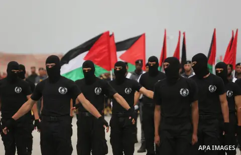 Palestinian police officers loyal to Hamas take part in a graduation ceremony in Gaza City March 30, 2017. Photo by Ashraf Amra