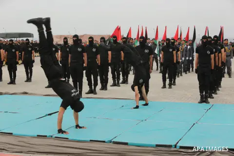 Palestinian police officers loyal to Hamas take part in a graduation ceremony in Gaza City March 30, 2017. Photo by Ashraf Amra