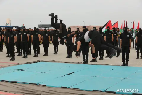 Palestinian police officers loyal to Hamas take part in a graduation ceremony in Gaza City March 30, 2017. Photo by Ashraf Amra