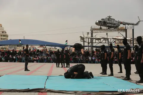 Palestinian police officers loyal to Hamas take part in a graduation ceremony in Gaza City March 30, 2017. Photo by Ashraf Amra