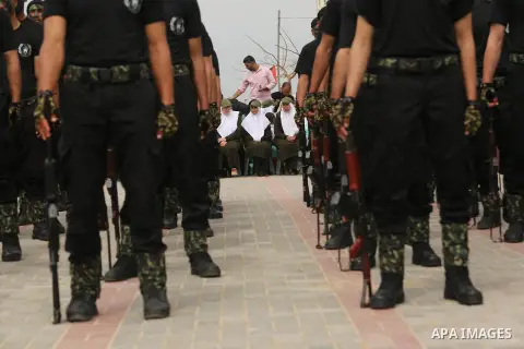 Palestinian police officers loyal to Hamas take part in a graduation ceremony in Gaza City March 30, 2017. Photo by Ashraf Amra