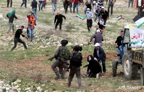 Palestinian demonstrators clash with Israel forces following a protest to mark land day in village of Madama, south of Nablus, on March 30, 2017 in the Israeli occupied West Bank. Land Day marks the killing of six Arab I...