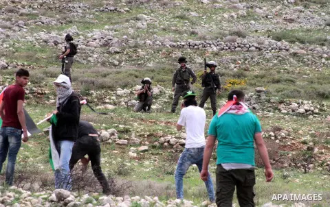 Palestinian demonstrators clash with Israel forces following a protest to mark land day in village of Madama, south of Nablus, on March 30, 2017 in the Israeli occupied West Bank. Land Day marks the killing of six Arab I...