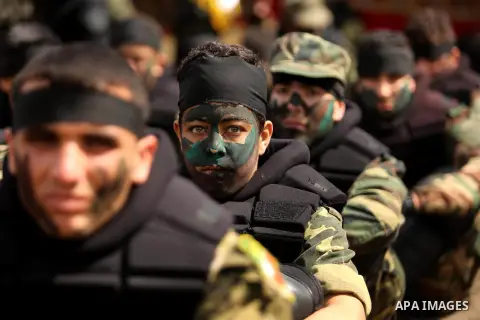 Palestinian high-school students show off their skills during a graduation ceremony from a military school course organised by the Palestinian security forces in Gaza strip, in Gaza City, on April 2, 2017. Photo by Ashra...