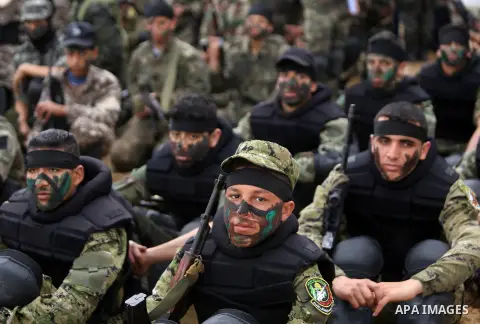 Palestinian high-school students show off their skills during a graduation ceremony from a military school course organised by the Palestinian security forces in Gaza strip, in Gaza City, on April 2, 2017. Photo by Ashra...