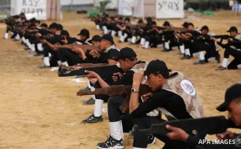 Palestinian high-school students show off their skills during a graduation ceremony from a military school course organised by the Palestinian security forces in Gaza strip, in Gaza City, on April 2, 2017. Photo by Ashra...