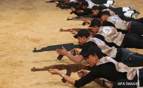 Palestinian high-school students show off their skills during a graduation ceremony from a military school course organised by the Palestinian security forces in Gaza strip, in Gaza City, on April 2, 2017. Photo by Ashra...