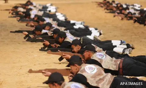 Palestinian high-school students show off their skills during a graduation ceremony from a military school course organised by the Palestinian security forces in Gaza strip, in Gaza City, on April 2, 2017. Photo by Ashra...
