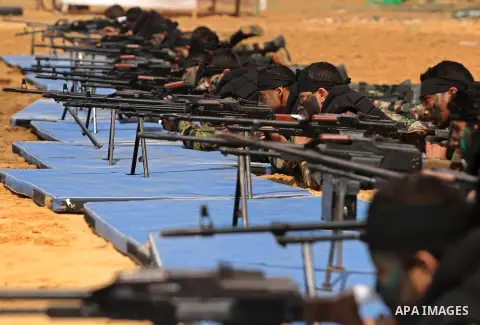 Palestinian high-school students show off their skills during a graduation ceremony from a military school course organised by the Palestinian security forces in Gaza strip, in Gaza City, on April 2, 2017. Photo by Ashra...