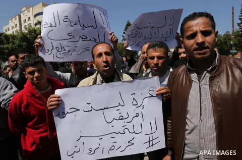 Palestinian employees paid by the Palestinian Authority take part in a protest against the decision of Palestinian goverment to deduct salaries of employees about 30%, in Gaza City April 5, 2017. Photo by Ashraf Amra