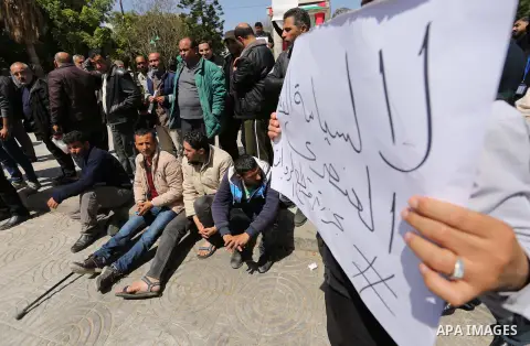 Palestinian employees paid by the Palestinian Authority take part in a protest against the decision of Palestinian goverment to deduct salaries of employees about 30%, in Gaza City April 5, 2017. Photo by Ashraf Amra