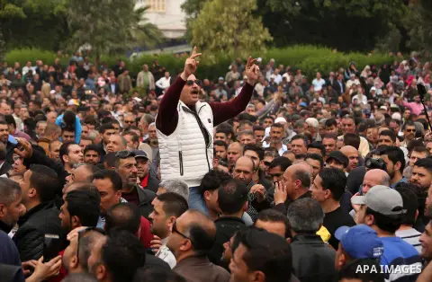 A Palestinian Authority employee chants slogans during a demonstration against the decision to reduce their salaries in Gaza City on April 8, 2017. Photo by Ashraf Amra