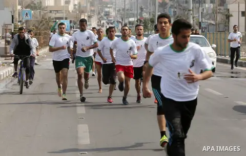 Palestinian youths take part in "Freedom Marathon" against the Israeli blockade of the Gaza Strip, in Gaza city on April 15, 2017. Photo by Ashraf Amra