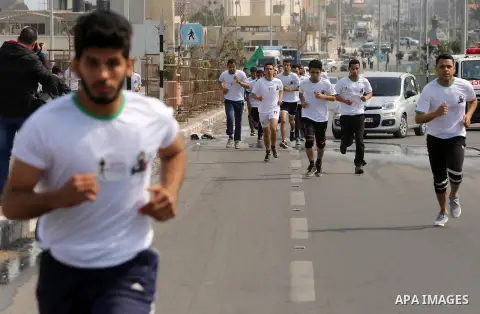 Palestinian youths take part in "Freedom Marathon" against the Israeli blockade of the Gaza Strip, in Gaza city on April 15, 2017. Photo by Ashraf Amra