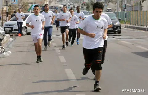 Palestinian youths take part in "Freedom Marathon" against the Israeli blockade of the Gaza Strip, in Gaza city on April 15, 2017. Photo by Ashraf Amra