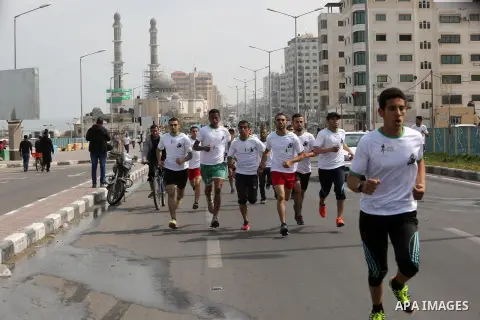 Palestinian youths take part in "Freedom Marathon" against the Israeli blockade of the Gaza Strip, in Gaza city on April 15, 2017. Photo by Ashraf Amra