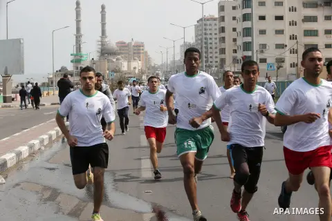 Palestinian youths take part in "Freedom Marathon" against the Israeli blockade of the Gaza Strip, in Gaza city on April 15, 2017. Photo by Ashraf Amra