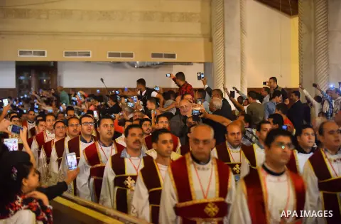 Egyptian Coptic Christians take part in an Easter Eve mass hosted by Pope Tawadros II at the St. Mark church in Cairo April 15, 2017. Photo by Amr Sayed