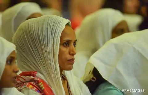 Egyptian Coptic Christians take part in an Easter Eve mass hosted by Pope Tawadros II at the St. Mark church in Cairo April 15, 2017. Photo by Amr Sayed