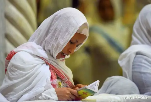 Egyptian Coptic Christians take part in an Easter Eve mass hosted by Pope Tawadros II at the St. Mark church in Cairo April 15, 2017. Photo by Amr Sayed