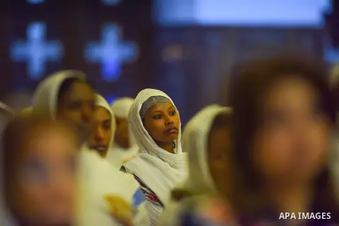 Egyptian Coptic Christians take part in an Easter Eve mass hosted by Pope Tawadros II at the St. Mark church in Cairo April 15, 2017. Photo by Amr Sayed